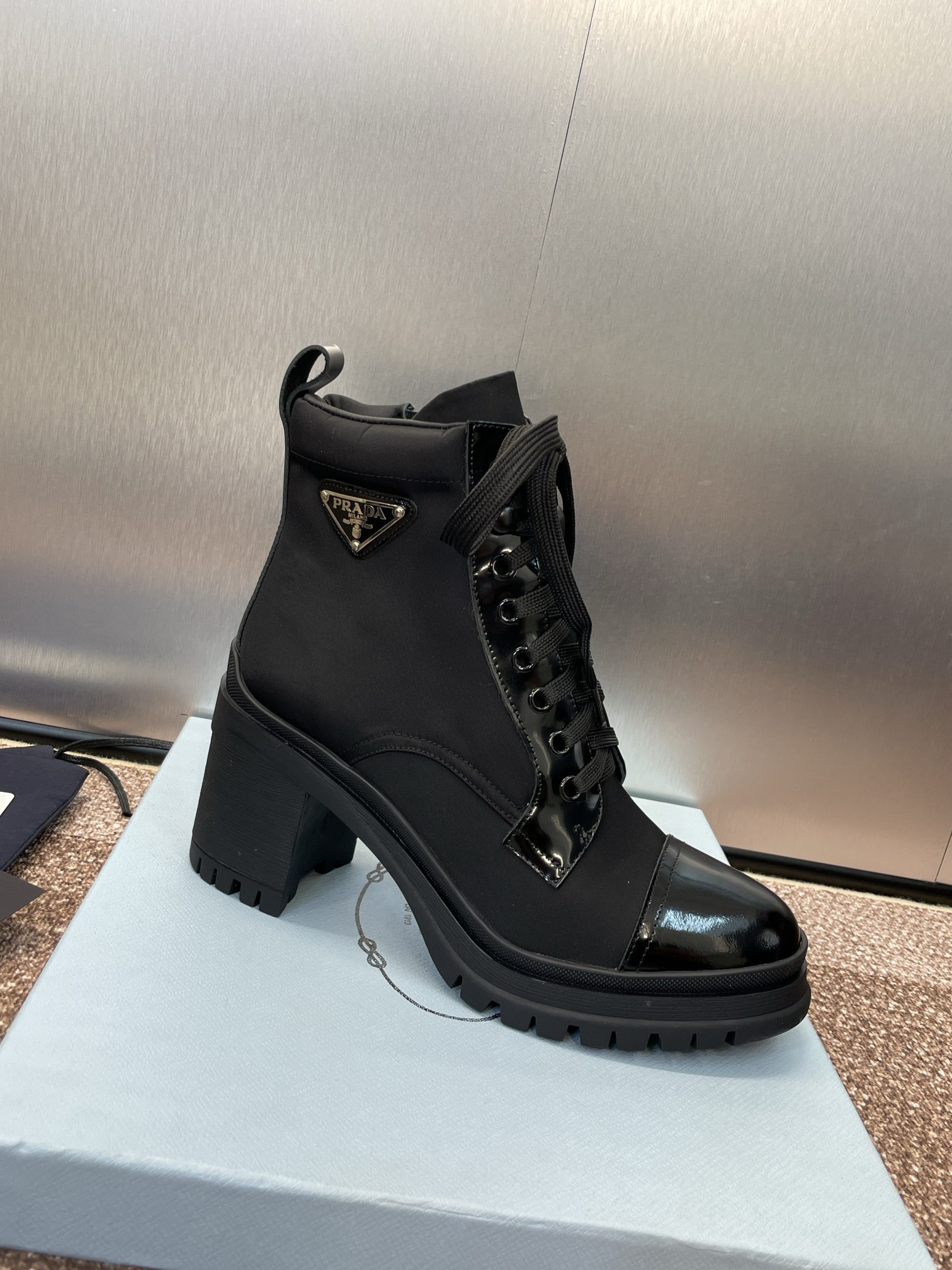 ua Pra*a re-nylon and leather booties
